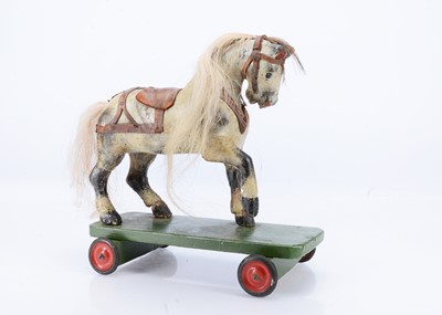 Lot 428 - A G & J Lines carved wooden horse on wheels
