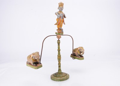 Lot 432 - An early 20th century Indian carved wooden Lord Krishna balancing toy
