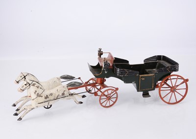 Lot 441 - A late 19th century French painted tinplate horse drawn open carriage