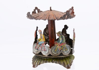 Lot 448 - A Meier cycling carousel Penny Toy