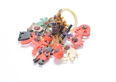 Lot 464 - A Japanese plastic teething ring with twelve plastic Kobi toy charms