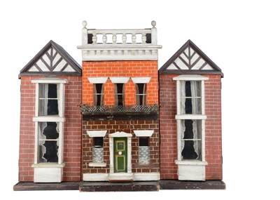 Lot 476 - An unusual late 19th century English wooden box back dolls’ house with later wings