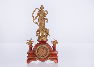Lot 479 - An early 20th century German cast-metal dolls’ house figural mantel clock