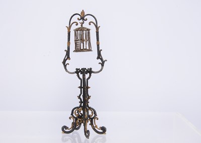 Lot 481 - A late 19th century German soft-metal dolls’ house birdcage and stand