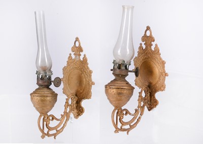 Lot 482 - A pair of late 19th century German cast-metal dolls’ house wall mounted oil-lamps