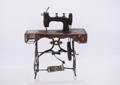 Lot 489 - A German larger scale dolls’ house soft metal sewing machines