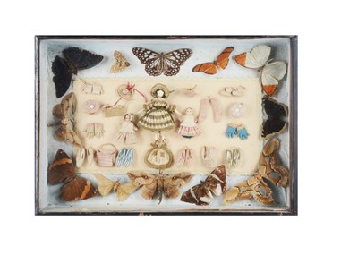 Lot 492 - A mid 19th century shadow box with Grodnerthal and wax dolls’ house dolls and finely knitted doll’s accessories