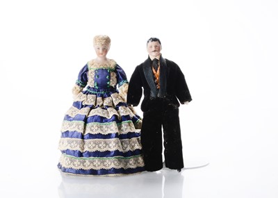 Lot 498 - A mid 19th century bisque shoulder-head dolls’ house couple