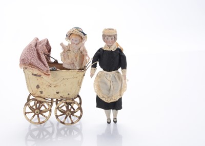 Lot 506 - A German dolls’ house bisque shoulder-head doll