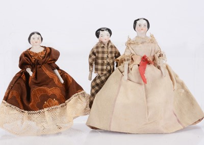 Lot 515 - Three 19th century china shoulder-head dolls’ house dolls