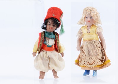 Lot 520 - Two French Liliputian all-bisque dolls' house dolls