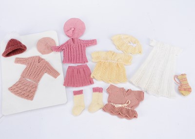 Lot 523 - Two finely knitted cotton small doll or larger dolls’ house doll outfits