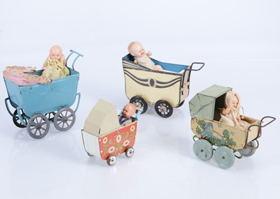 Lot 535 - Four 1920-40s dolls’ house tinplate perambulators
