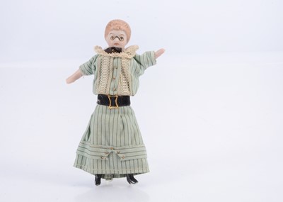 Lot 538 - A very rare bisque shoulder-head doll with moulded pince-nez