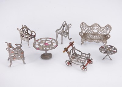 Lot 547 - Cast-metal dolls’ house furniture