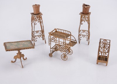 Lot 549 - Two German soft metal dolls’ house plant stands, circa 1900