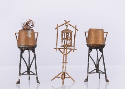 Lot 557 - Two German cast-metal Jugendstil plant pots on separate stands