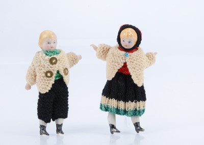 Lot 567 - A pair of Simon & Halbig bisque children shoulder-head dolls’ house dolls in original knitted clothes