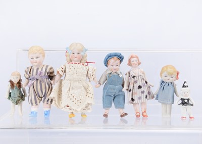 Lot 571 - Seven all-bisque child dolls’ house dolls