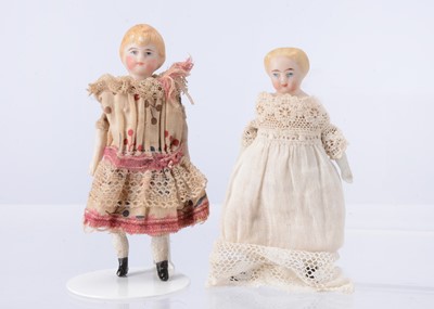 Lot 572 - A German bisque child shoulder-head dolls’ house doll