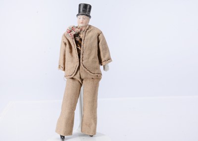Lot 573 - A German bisque shoulder head dolls house gentleman doll with moulded top hat