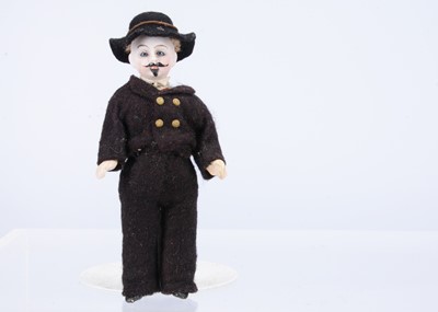 Lot 580 - A rare Gebruder Kuhnlenz small bisque headed doll