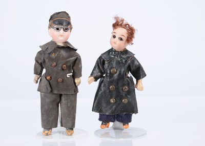 Lot 582 - Two bisque headed dolls’ house dolls