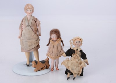 Lot 623 - Three German dolls’ house dolls