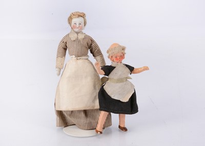 Lot 627 - A German domed head bisque shoulder-head dolls’ house maid