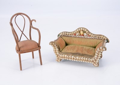 Lot 631 - A late 19th century dolls’ house sofa with shell decoration