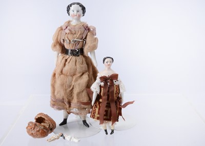 Lot 633 - An 19th century German larger china shoulder head dolls’ house doll