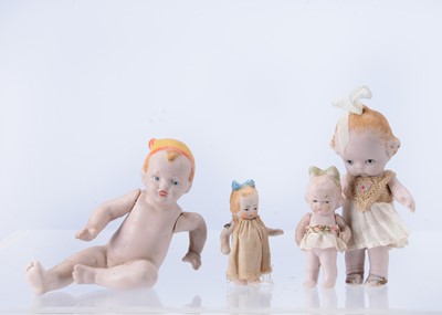 Lot 643 - There 1920s small all bisque ‘Cutie’ character dolls and a seat baby