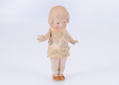 Lot 644 - A rare small size Gebruder Heubach all bisque girl doll with blue glazed hair bow
