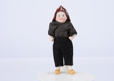Lot 647 - A rare German all-bisque boy with moulded sou'wester hat