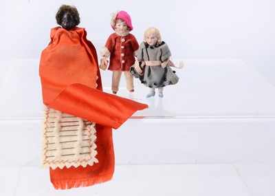 Lot 655 - A German black all-bisque sewing companion dolls’ house doll, probably Gebruder Kuhnlenz
