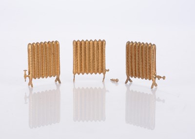 Lot 663 - Three German cast-lead dolls’ house radiators