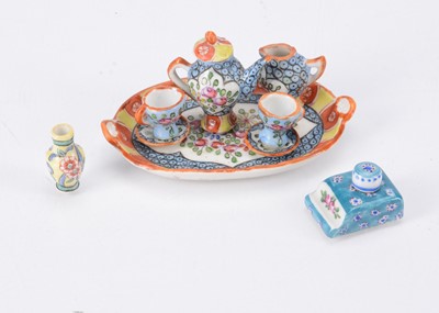 Lot 666 - A Desvres porcelain dolls’ house tea set for two on tray