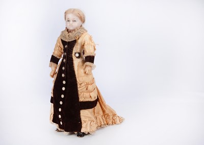 Lot 667 - An 19th century English poured wax child doll in elaborate outfit