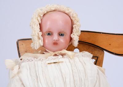 Lot 672 - An 19th century F. Aldis (England) poured wax doll dressed as a baby