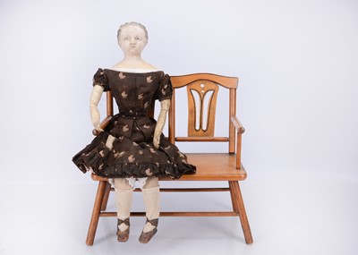 Lot 677 - A mid 19th century Grodnertal carved wooden shoulder-head doll