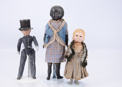 Lot 679 - Three small 19th century dolls