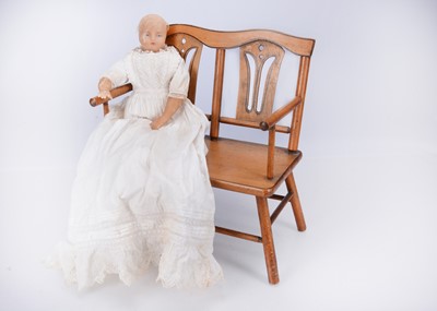 Lot 681 - A late 19th century English poured wax baby doll
