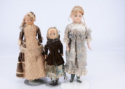 Lot 686 - Three 19th century German wax over composition dolls