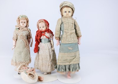 Lot 687 - Four 19th century German wax over composition dolls