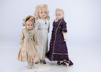 Lot 688 - Three 19th century German wax over composition dolls