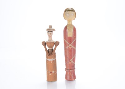 Lot 693 - Two rudimental wooden dolls
