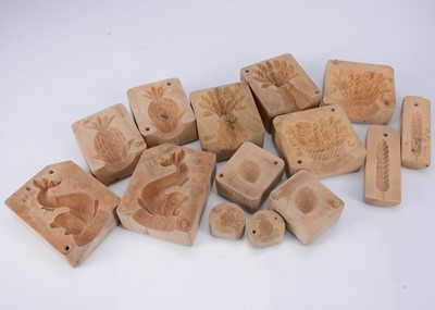 Lot 714 - Seven late  19th century carved wooden butter moulds