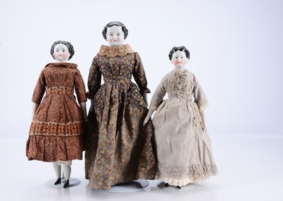 Lot 749 - Three 19th century glazed china shoulder-head lady doll