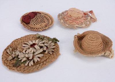 Lot 765 - Four doll’s straw hats