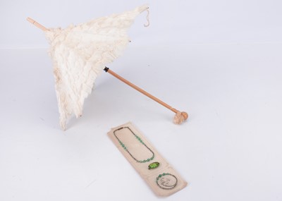 Lot 766 - A French doll’s parasol and jewellery set on original card